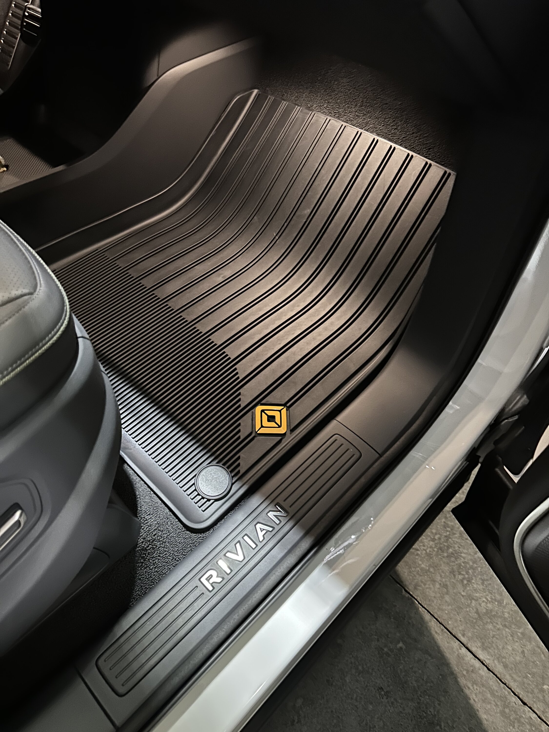 Rivian R1T R1S All weather floor mats logos are black A0D34184-C4F3-4D1C-BF71-73DC2A28E654