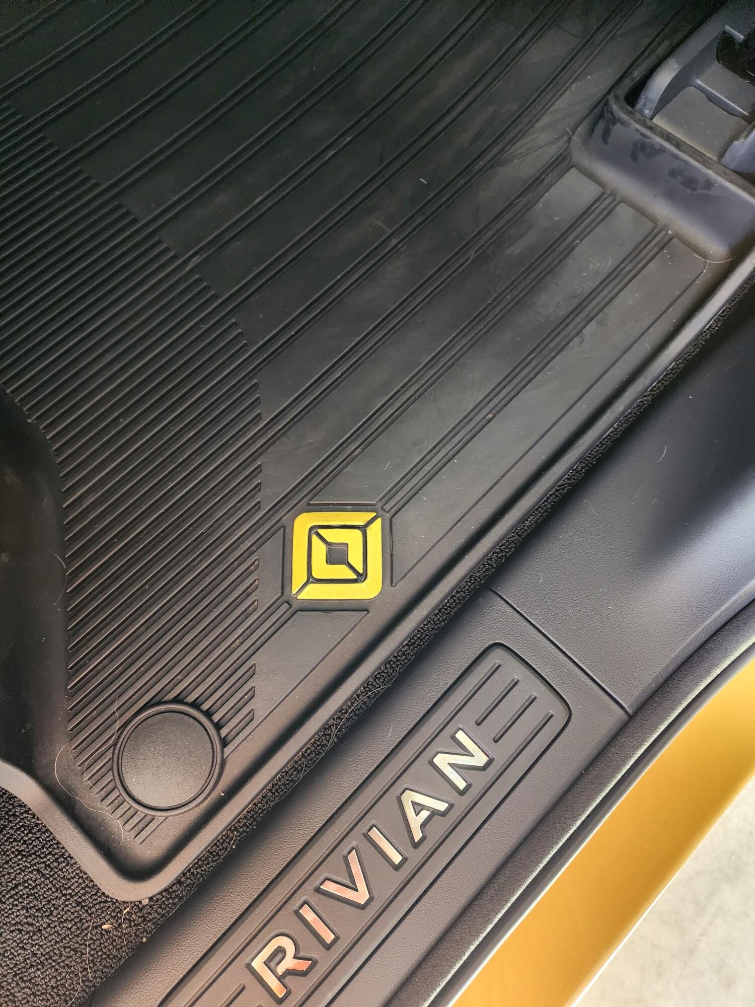 Rivian R1T R1S All weather floor mats logos are black Rivian Yellow Emblem 2