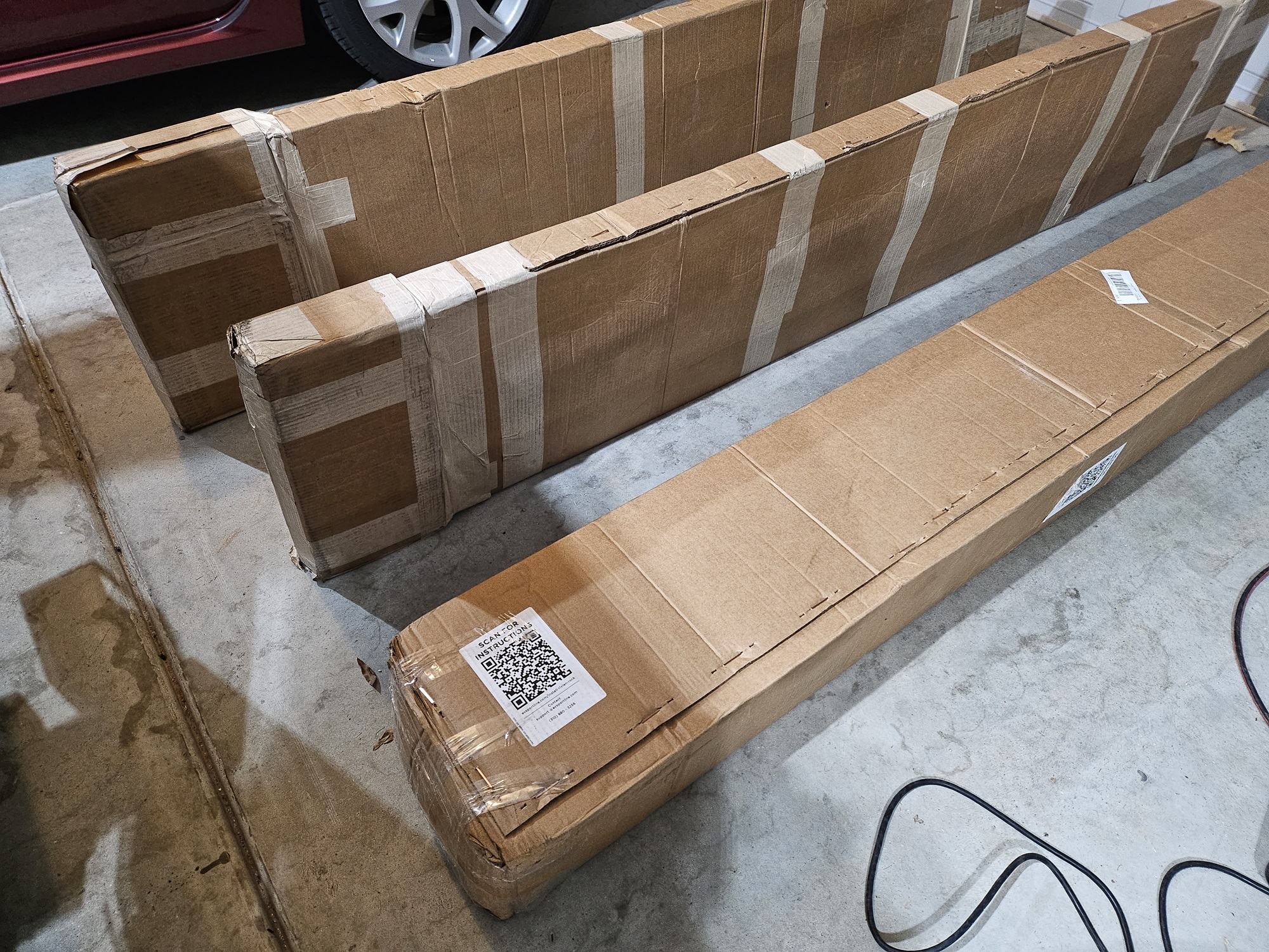 Rivian R1T R1S Introducing RMaxx Running Boards & Rock Sliders for Rivian R1T / R1S from Team 1EV Shipping Boxes View 1 - Compressed