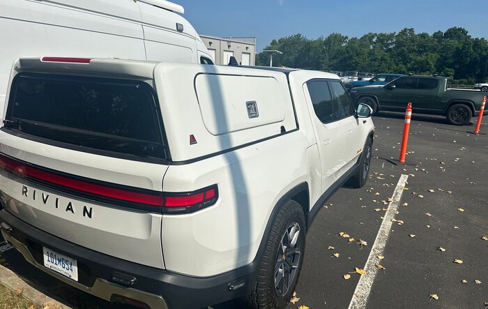 Leer Bed Cap Topper and Brush Guard spotted on Rivian R1T manufacturer plated vehicle