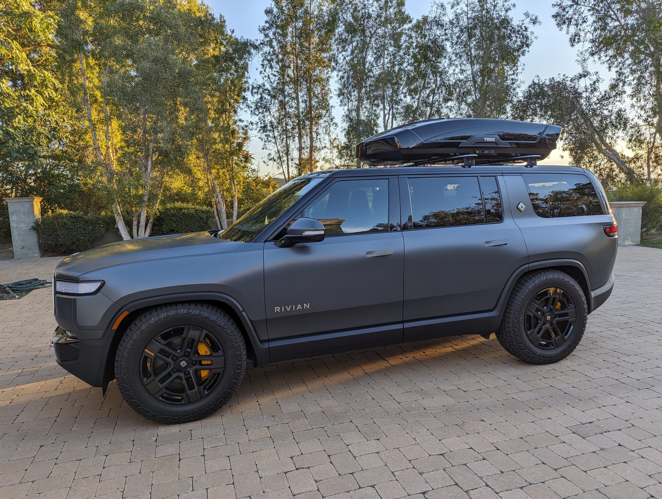 Thule Motion XT XL cargo box fits well on R1S roof crossbars | Rivian ...